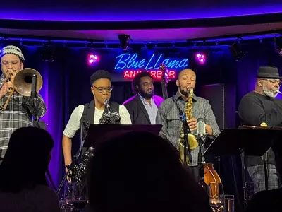 From left to right: Zekkereya El-Magharbel (trombone), Erinn Alexis (baritone saxophone), Jonathan Muir-Cotton (bass), Marcus Elliot (saxophone / bandleader), and Dwight Adams (trumpet).