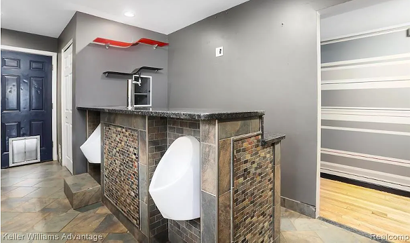 Image: This Ferndale 'bro' pad has Detroit Lions basketball court and is listed at $165K